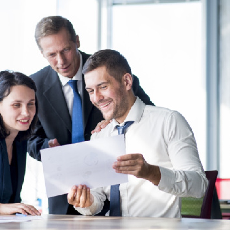 Buisness people talking about a file 