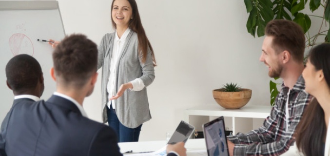 Woman presents an overview to her colleagues